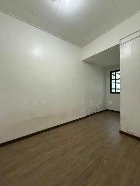 Room features: white painted walls, laminate flooring, single window with grid pattern, ceiling light fixture.