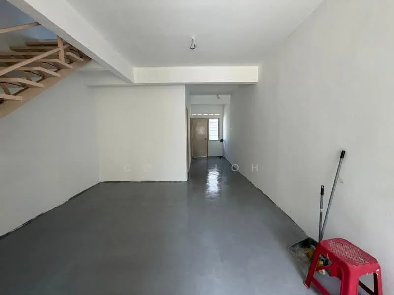 Room features: white painted walls, grey polished concrete flooring, staircase with wooden steps, single door at entrance, no visible furniture or decor, ceiling light fixture, clean and uncluttered space; style: minimalist.