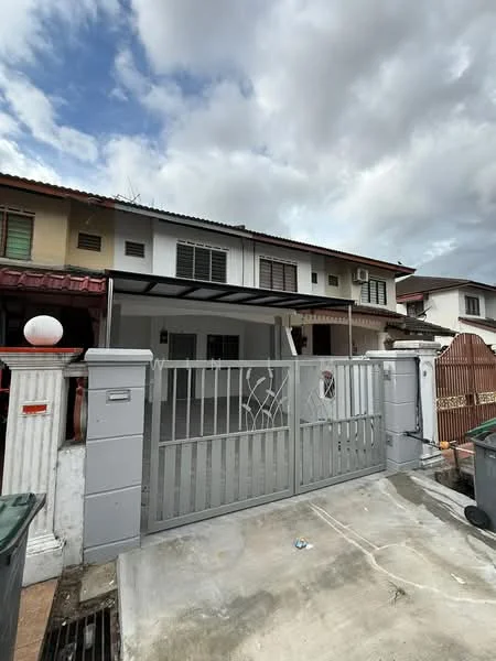 Exterior type: linked terrace house; features: grey metal gate, concrete driveway, two-storey building, white painted facade, red tiled roof, air conditioning unit visible, front porch with overhang, surrounded by residential buildings, manicured lawn, paved walkway; style: modern.