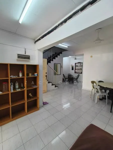 Living features: white painted walls, glossy white tile flooring, ceiling fan, open shelving unit, dining table with chairs, staircase leading to upper floor, natural light from windows, decorative wall art; style: modern.