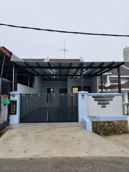 Exterior type: detached bungalow; features: metal gate, concrete driveway, covered car porch, grey painted facade, stone cladding at base, sloped roof, satellite dish, front garden area, surrounded by residential buildings; style: modern.