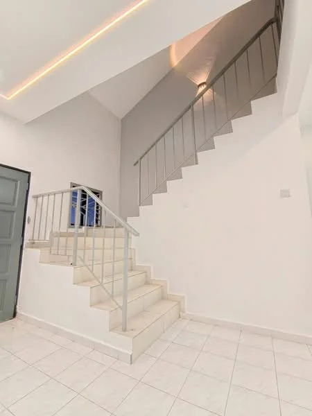Room features: white painted walls, grey accent wall, white tiled flooring, staircase with metal railing, high ceiling, recessed lighting, door with grey finish; style: modern.
