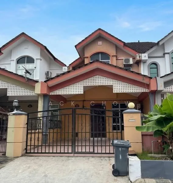 Exterior type: linked terrace house; features: gated entrance, cream painted facade, red tiled roof, decorative eaves, front porch, metal gate, driveway, landscaped garden, air conditioning units visible, two-storey structure; style: modern.