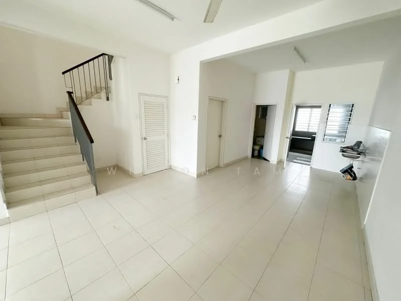 Room features: white painted walls, tile flooring, staircase with wooden railing, windows with horizontal slats, open layout, kitchen area visible, doorway leading to another room, ceiling lights; style: minimalist.