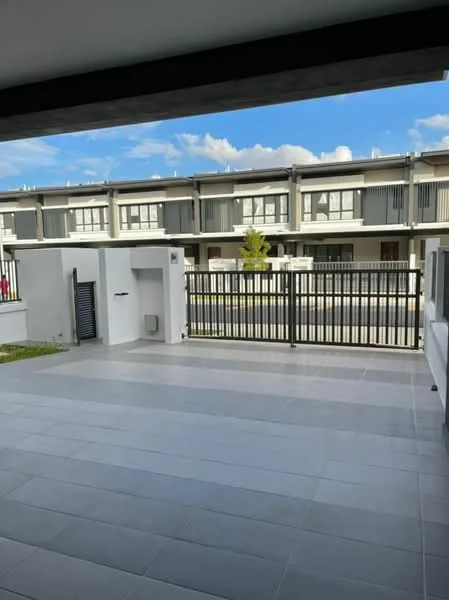 Exterior type: linked terrace house; features: paved outdoor area, black metal railing, manicured lawn, clear blue sky, modern facade of neighboring houses, sliding glass door access, concrete wall, grey tiled flooring; style: modern.