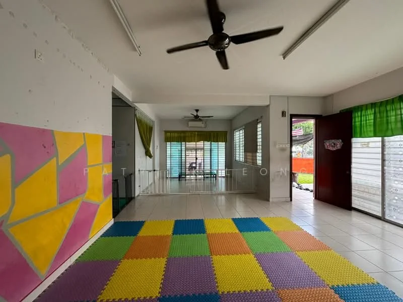 Room features: white painted walls, ceiling fan, tiled flooring, large windows with green curtains, colorful foam floor tiles, open layout, air conditioning unit, door leading outside; style: modern; view: garden.