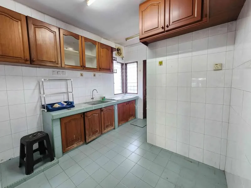 Kitchen features: wooden upper cabinets, wooden lower cabinets, single-bowl stainless-steel sink, chrome faucet, green laminate countertop, white tiled walls, light blue floor tiles, window for natural light, stool, space for refrigerator.