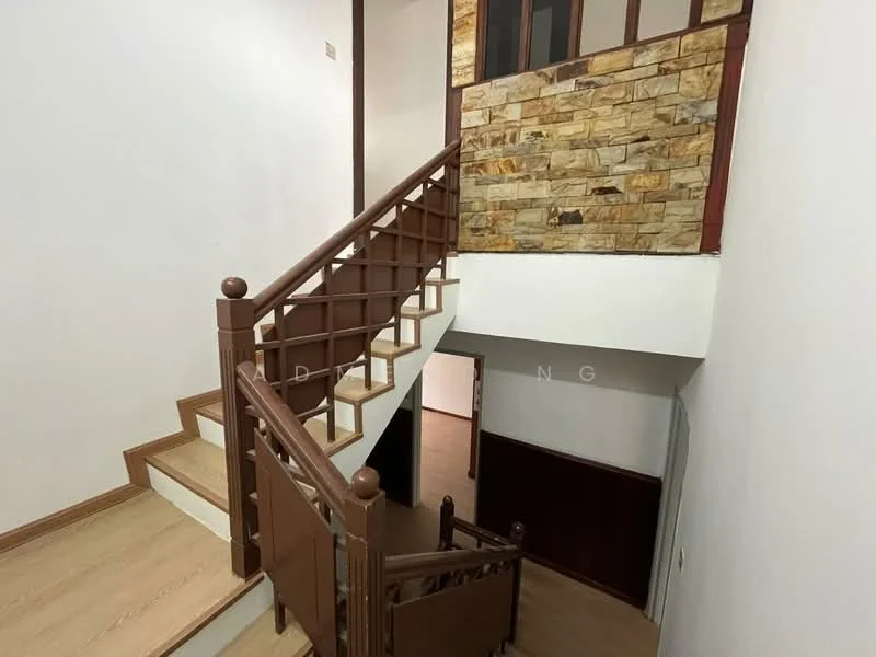 Room features: wooden staircase with railing, light wooden flooring, white painted walls, stone accent wall, landing area with natural light, brown wooden handrail, open space design, no visible furniture; style: modern.