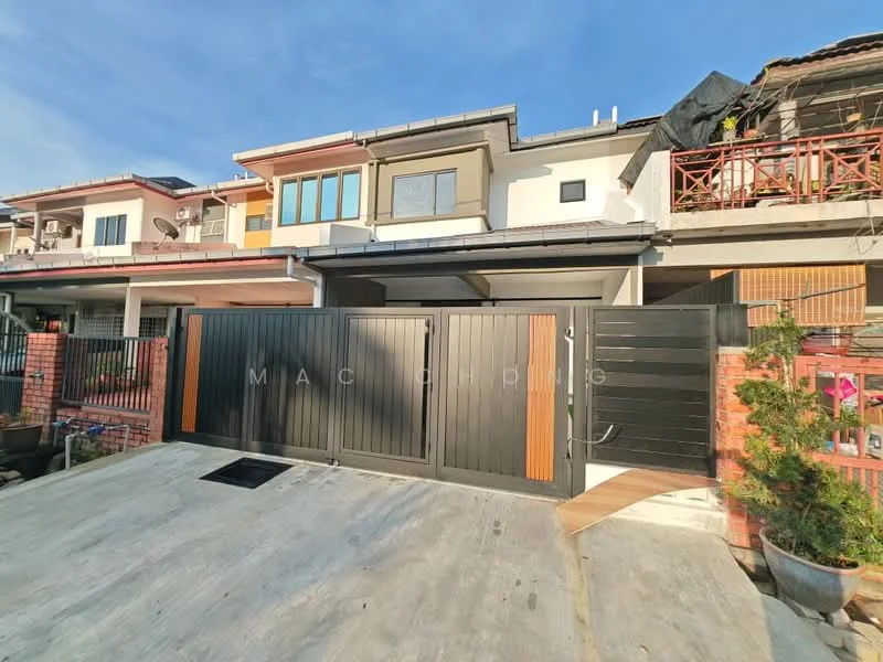 Exterior type: linked terrace house; features: black metal gate with wooden accents, concrete driveway, brick wall fencing, two-storey structure, multiple air conditioning units visible, balcony on upper floor, large windows with brown frames, roof overhang, manicured landscaping with potted plants; style: modern.