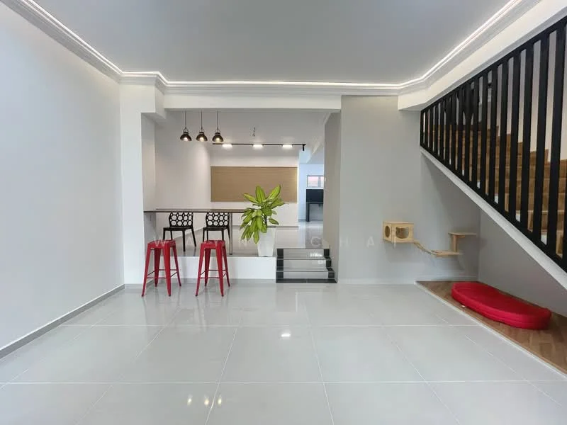 Living features: glossy ceramic tile flooring, white painted walls, recessed LED downlights, pendant lighting with three bulbs, open layout, staircase with wooden steps and black railing, large window for natural light, indoor plant, red accent seating, bar counter with stools; style: modern.