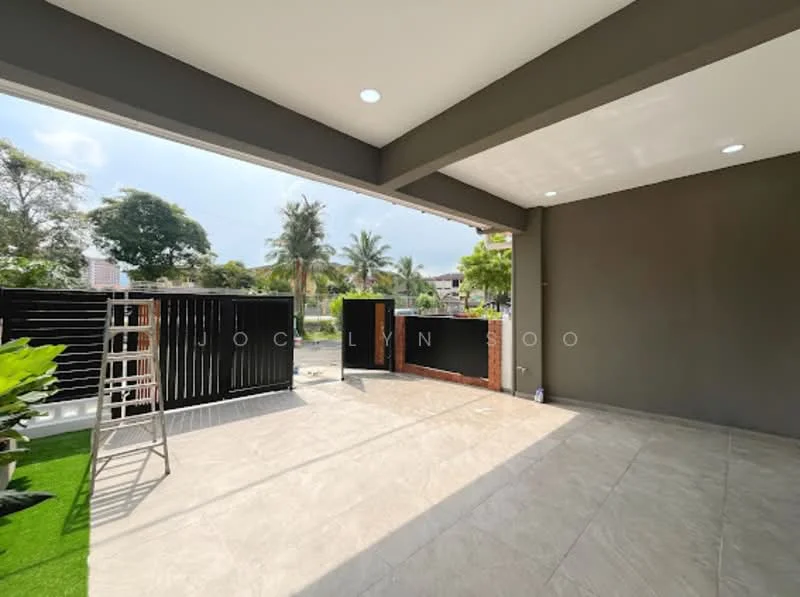 Exterior features: grey painted walls, large overhang roof, porcelain tile flooring, manicured lawn, paved walkway, black metal gate, outdoor lighting, tropical landscaping, sliding glass door, open space, fence, ladder; style: modern.