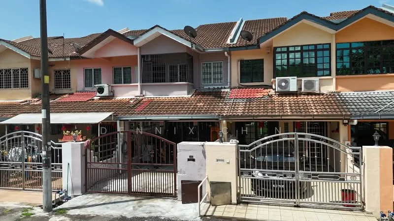 Exterior type: linked terrace house; features: two-storey building, red tiled roof, cream painted facade, brown wooden window frames, metal gates, front porch area, visible air conditioning units, paved driveway, mature trees in vicinity, surrounded by other terrace houses; style: modern.