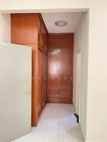 Room features: built-in wooden wardrobe with multiple drawers, cream painted walls, white tiled flooring, ceiling light fixture, door leading to another room.