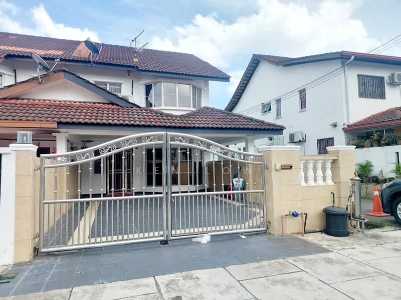 Exterior type: semi-detached house; features: gated entrance with decorative metal gate, paved driveway, red tiled roof, cream painted facade, white balustrade, manicured garden area, multiple air conditioning units visible, outdoor lighting fixtures, brick wall fencing, stone-paved walkway; style: modern.