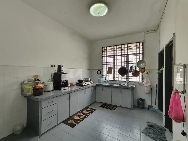 Kitchen features: grey laminate cabinetry, white tiled walls, grey tiled flooring, stainless-steel sink, single-bowl sink, chrome faucet, built-in gas stove, countertop with space for appliances, window with metal grille, kitchen rug with pattern, hanging pots and pans, coffee machine, water dispenser.