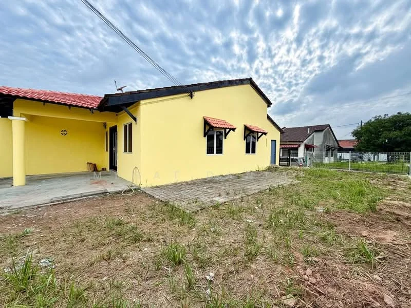 Exterior type: detached bungalow; features: yellow painted facade, red tiled roof, windows with black frames, concrete flooring, surrounding grass area, open space in front, single-storey, manicured lawn, adjacent residential buildings; style: modern.