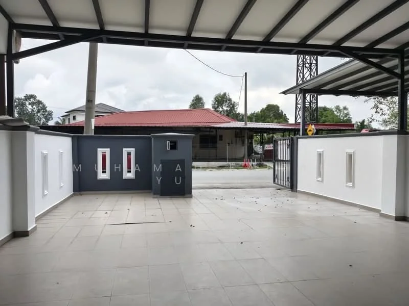 Exterior features: paved driveway, white painted walls, grey accent wall, gated entry, roof overhang, windows with white frames, surrounding greenery, street view, manicured lawn; style: modern.