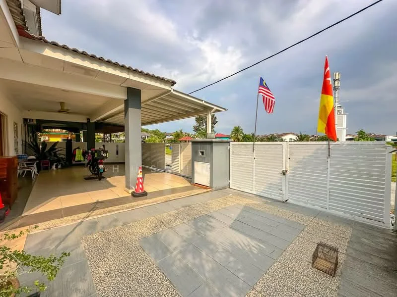 Exterior type: detached bungalow; features: covered porch, paved walkway, white fencing, flagpoles with flags, manicured lawn, outdoor seating area, sliding gate, landscaped garden, roof overhang, driveway; style: modern.
