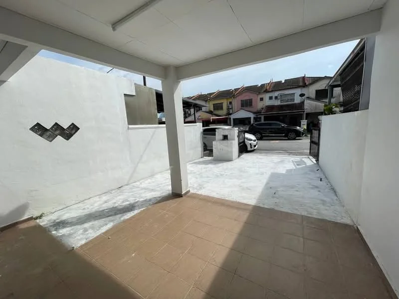 Exterior type: linked terrace house; features: white painted walls, concrete flooring, open outdoor space, car parking area, surrounded by residential houses, sliding gate, manicured lawn, driveway with interlocking pavers; style: modern.