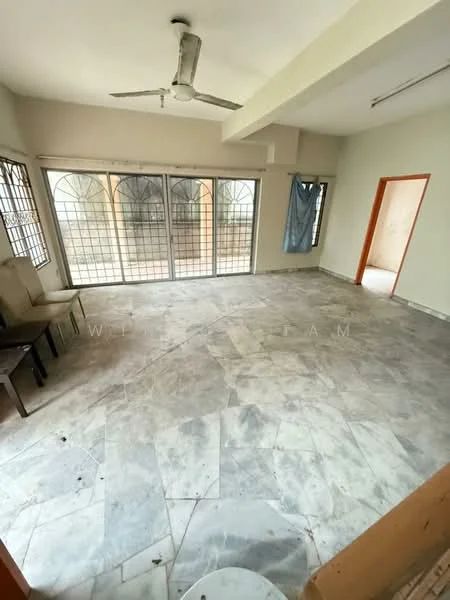 Room features: marble flooring, white painted walls, ceiling fan, large windows with metal grilles, natural light, empty space, no visible furniture, sliding door to outdoor area.
