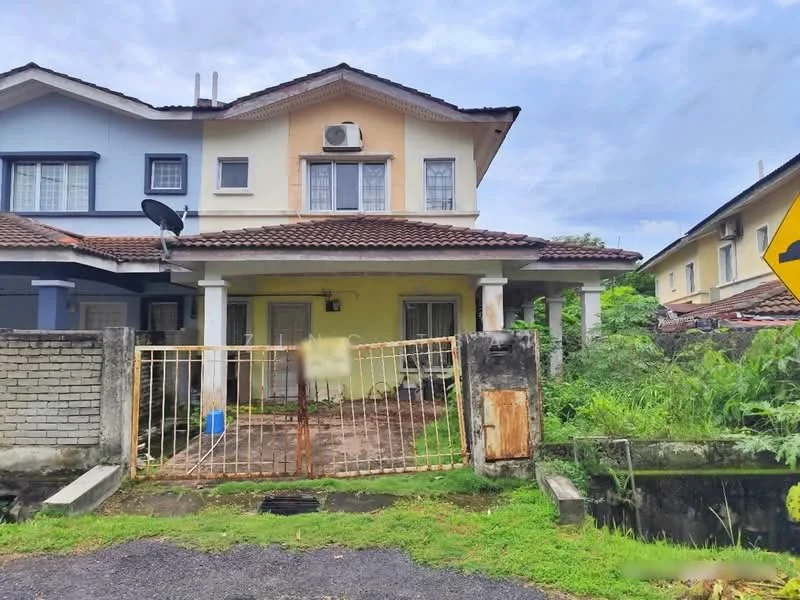Exterior type: semi-detached house; features: two-storey structure, light blue and cream painted facade, red tiled roof, front porch with columns, fenced yard with gate, visible air conditioning unit, overgrown landscaping, paved walkway, satellite dish on roof, gravel driveway; style: modern.