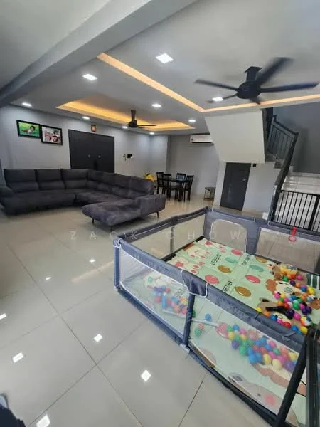 Living features: grey fabric sectional sofa, ceiling fan with light, recessed LED downlights, cream painted walls, polished ceramic tile flooring, area rug, wall-mounted TV, dining table with chairs, playpen with colorful balls, staircase with black railing; style: modern.