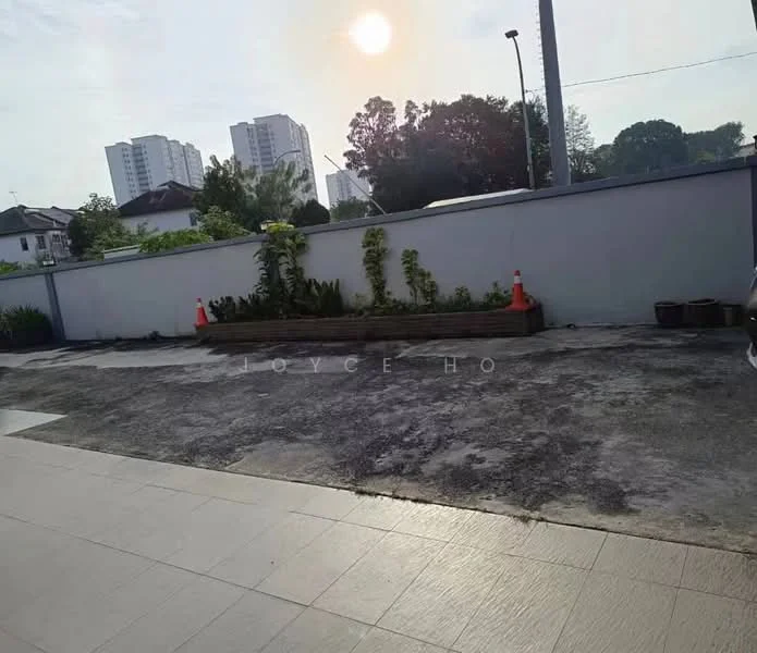 Exterior features: paved driveway, landscaped garden with plants, concrete wall, sunset view, surrounding residential buildings, traffic cones; style: modern.