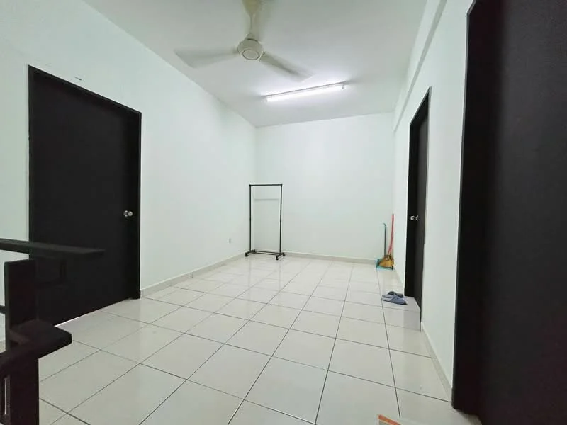 Room features: white painted walls, tile flooring, ceiling fan, two black doors, one clothing rack, one broom, one dustpan, fluorescent ceiling light.