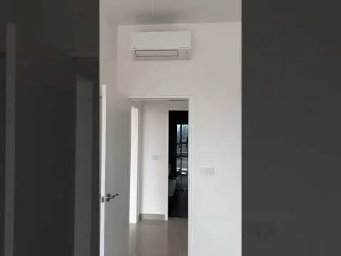 Room features: white painted walls, light grey tile flooring, 1 wall-mounted split AC, door with silver handle, door frame, light switch, neutral decor; style: modern.