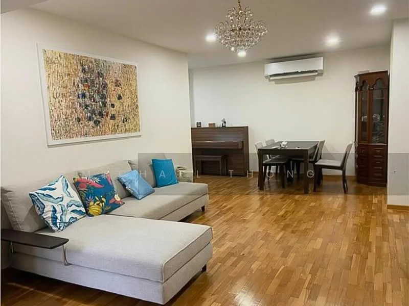 Living features: L-shape sectional sofa in light grey, decorative throw pillows with floral and abstract patterns, wooden flooring, chandelier, wall-mounted split AC, framed artwork on wall, wooden dining table with chairs, piano, display cabinet, neutral painted walls; style: modern.