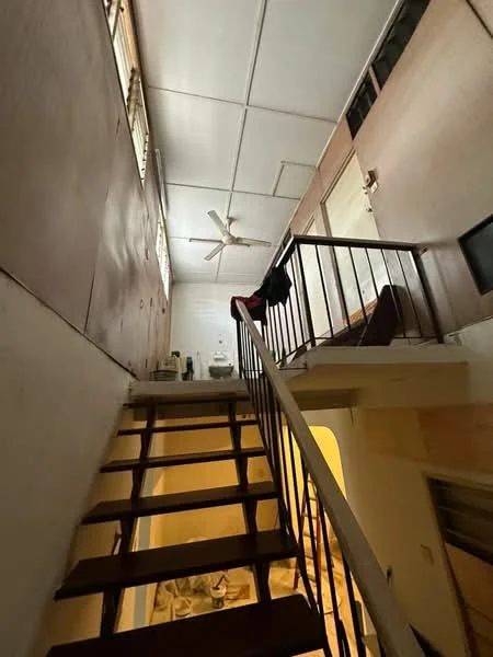 Room features: wooden staircase, white ceiling with recessed lighting, ceiling fan, wooden railing, light-colored walls, large windows for natural light, open space at the top of the stairs.