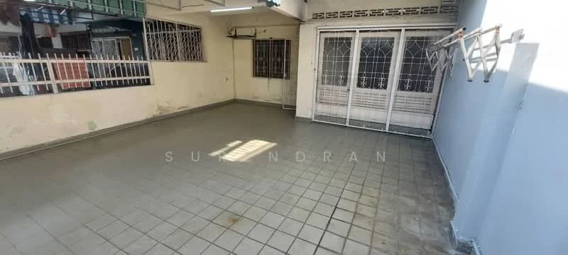 Room features: grey tiled flooring, white painted walls, metal grilles on windows, sliding glass door, natural light from windows, open layout, high ceiling, no visible furniture.