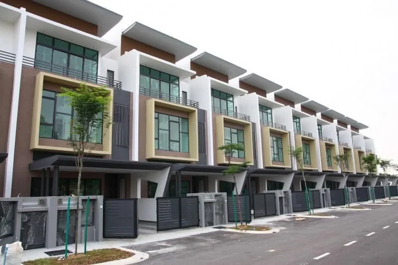 Exterior type: linked terrace house; features: modern facade with geometric design, multiple storeys, large windows with black frames, balconies with glass railings, cream and brown painted facade, manicured landscaping with small trees, paved driveway, gated entry with metal gates; style: modern.
