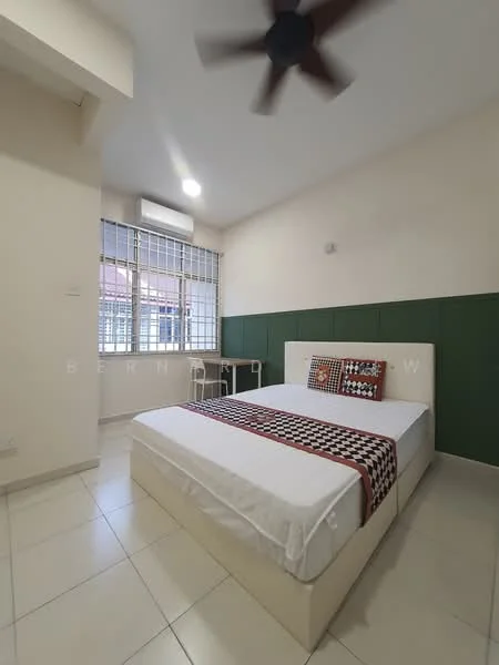 Bedroom features: queen-size bed, upholstered headboard, decorative throw blanket, study desk, chair, floor-to-ceiling windows, white painted walls, green accent wall, ceiling fan, tile flooring, air conditioning unit, natural light; style: modern.