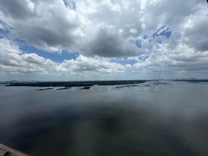 Exterior features: waterfront view, cloudy sky, distant city skyline, islands in the water, reflective water surface.
