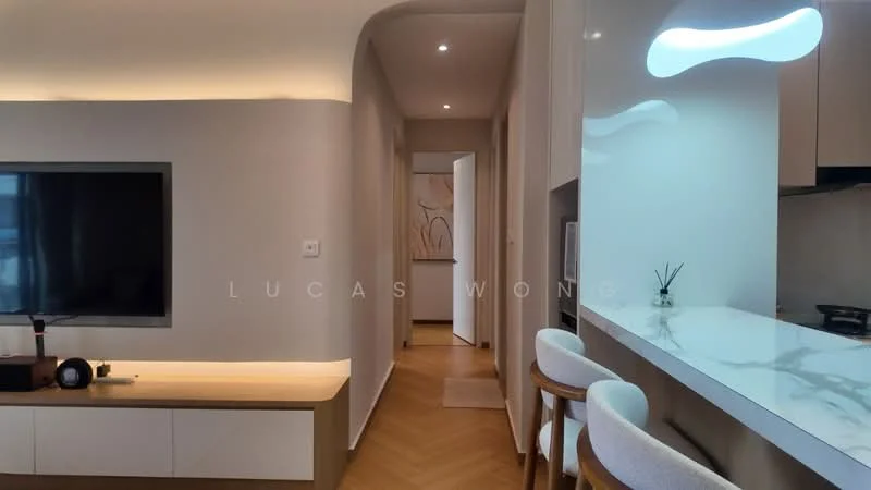 Living features: light wood flooring, white walls, recessed downlights, wall-mounted TV, TV console with storage, open kitchen bar with seating, marble countertop, decorative wall art, neutral color palette; style: modern. Room features: white painted walls, doorway leading to hallway, light wood flooring.