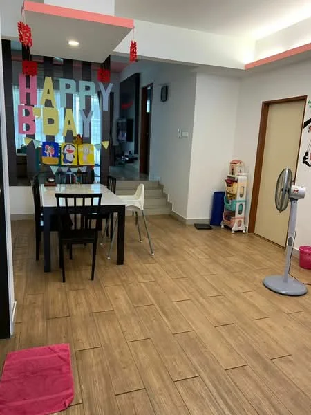 Dining features: wooden dining table with black finish, 4 white dining chairs, tile flooring with wood effect, decorative wall with 'HAPPY BIRTHDAY' banner, wall-mounted fan, pink area rug, open layout to living area, staircase visible in background; style: modern. Room features: white painted walls, ceiling with recessed lighting, doorway leading to another room.