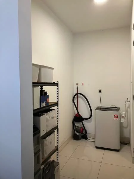 Laundry features: white painted walls, tile flooring, stacked storage shelves, vacuum cleaner, washing machine, utility sink, light fixture.