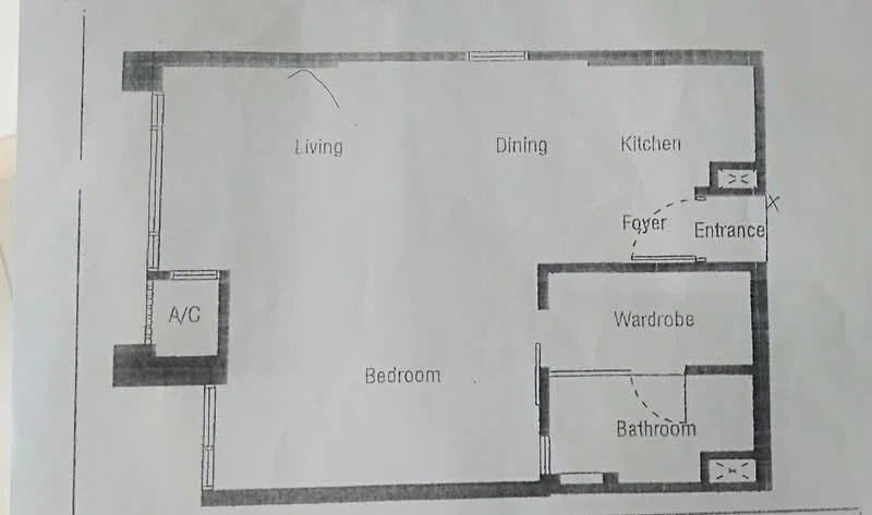Floor plan: 1-bedroom 1-bathroom unit; features: open-plan living-dining-kitchen, foyer at entrance, wardrobe space, bedroom with window, bathroom adjacent to bedroom, A/C unit in living area.