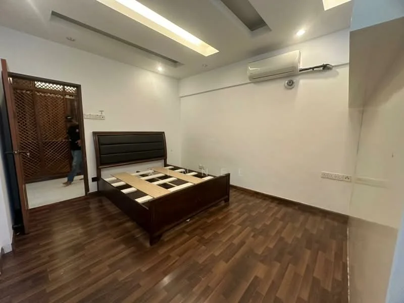 Bedroom features: wooden flooring, false ceiling with recessed lighting, wall-mounted air conditioning unit, dark wood bed frame, built-in wardrobe, white painted walls, no visible decor, single window, door leading to another room; style: modern.