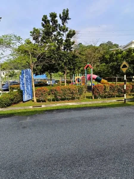 Exterior type: landscape garden; features: playground equipment, manicured lawn, mature trees, bushes, paved walkway, road signage, parking area, greenery, open space; style: modern.