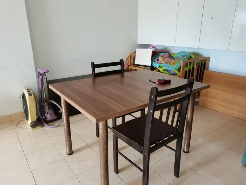 Dining features: wooden dining table, 4 dining chairs, light-colored tiled flooring, white painted walls, storage cabinets, colorful children's playmat, foldable crib, vacuum cleaner, wall-mounted storage, decorative items on table; style: modern.