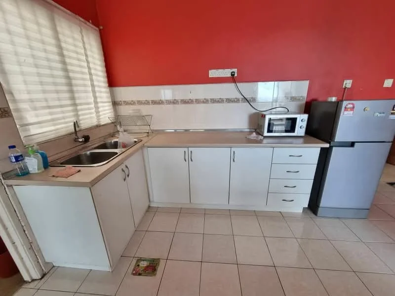 Kitchen features: single-bowl stainless-steel sink, chrome pull-down faucet, white cabinetry with handles, countertop with light grey surface, microwave, fridge, tile flooring, red painted walls, window with sheer curtains, dish rack, cleaning supplies on countertop; style: modern.