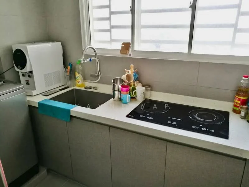 Kitchen features: double-bowl stainless-steel sink, chrome pull-down faucet, induction cooktop, grey cabinetry, white countertop, kitchen towels, various kitchen utensils, appliance (microwave), washing machine, window with horizontal slats; style: modern.
