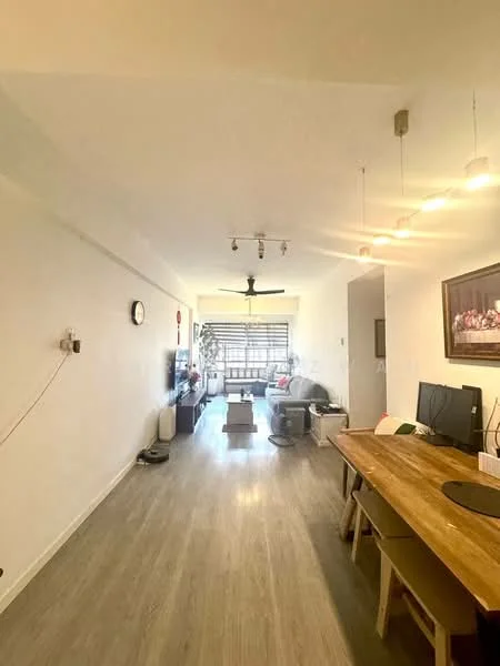 Living features: light wood laminate flooring, white painted walls, recessed downlights, 5-blade ceiling fan with light, wall-mounted TV, TV console, dining table with wooden chairs, large window with sheer curtains, decorative artwork on wall, open layout, natural light from window; style: modern.