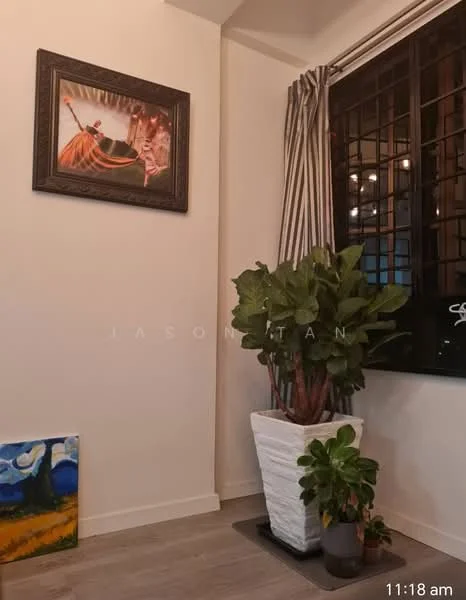 Room features: white painted walls, wooden flooring, black-framed windows, striped curtains, framed artwork on wall, potted plant in white planter, potted plant on floor, decorative painting on floor; style: modern.
