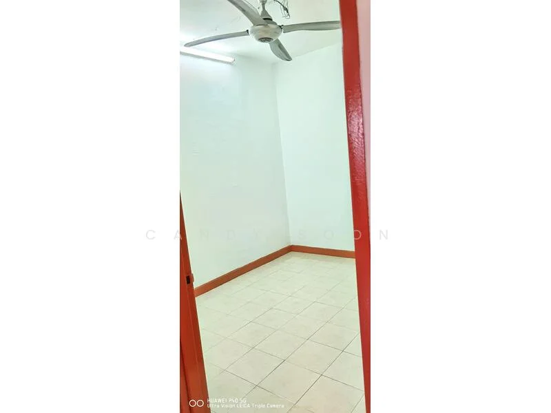 Room features: white painted walls, tile flooring, ceiling fan, LED ceiling light, red door frame, corner room, no visible furniture.