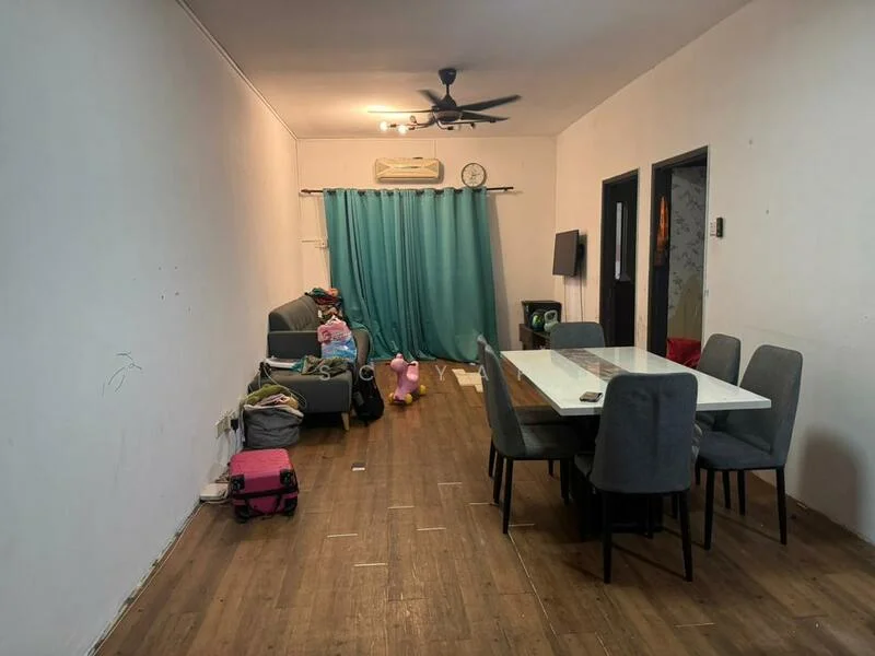 Dining features: wooden flooring, white painted walls, 5-blade ceiling fan, dining table with 6 chairs, green curtains, wall-mounted TV, sofa, luggage bags, decorative wall clock, stuffed toy.