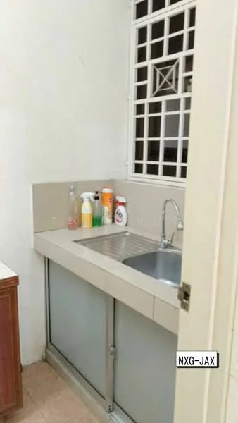 Kitchen features: single-bowl stainless-steel sink, chrome pull-down faucet, light-colored countertop, white tiled backsplash, wood cabinetry, glass sliding door, cleaning supplies on countertop, window with security grille.