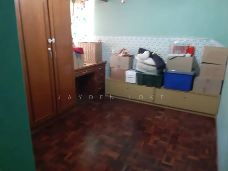 Room features: wooden flooring, green painted walls, built-in wardrobe, desk with drawers, boxes stacked, baskets, decorative wall tiles, window with curtains.